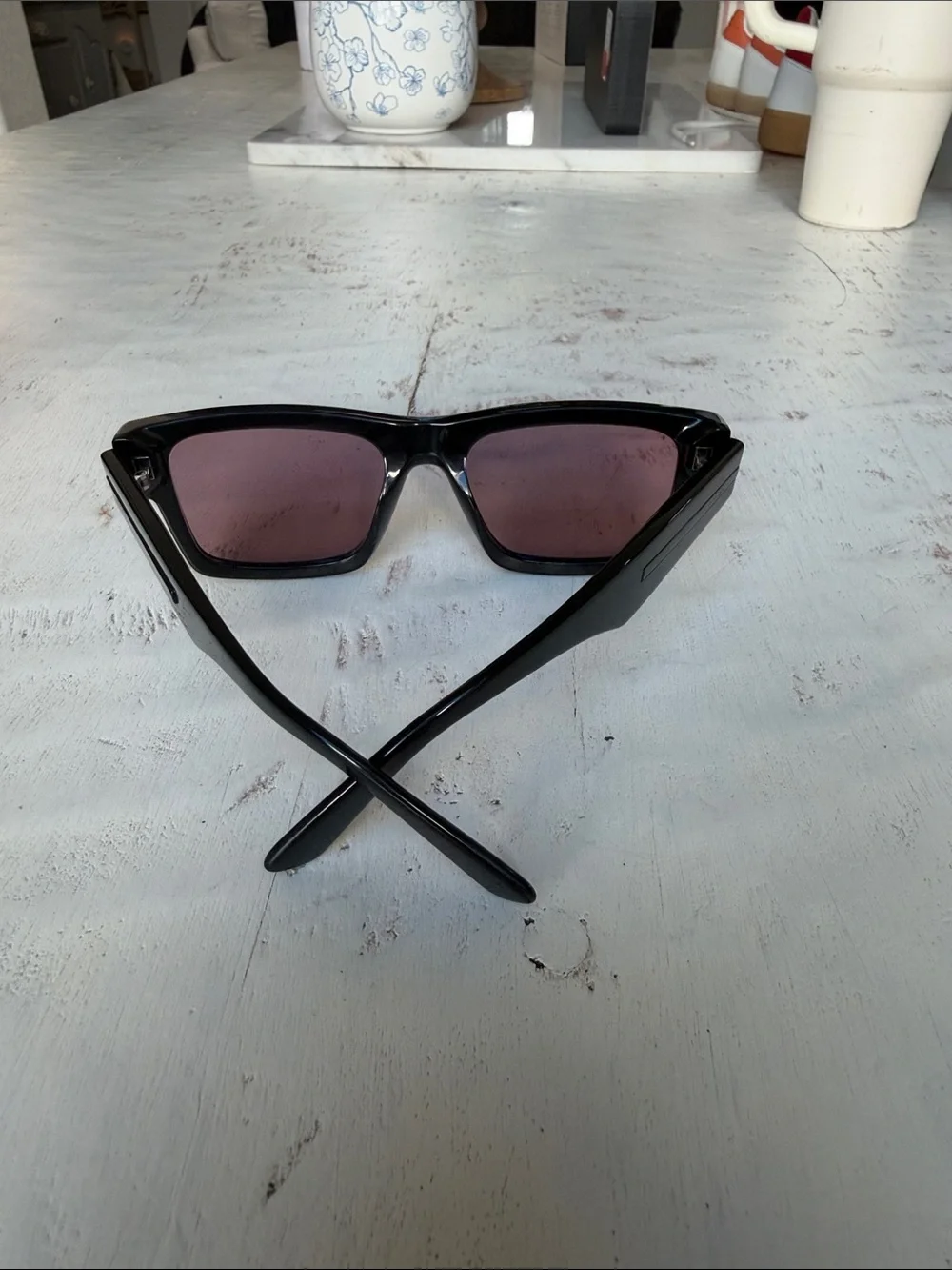 Prada Black Frame Sunglasses with Rose-Tinted Lenses